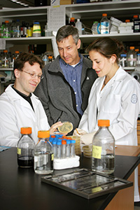 Dr. Allis with 2 colleagues in lab setting 